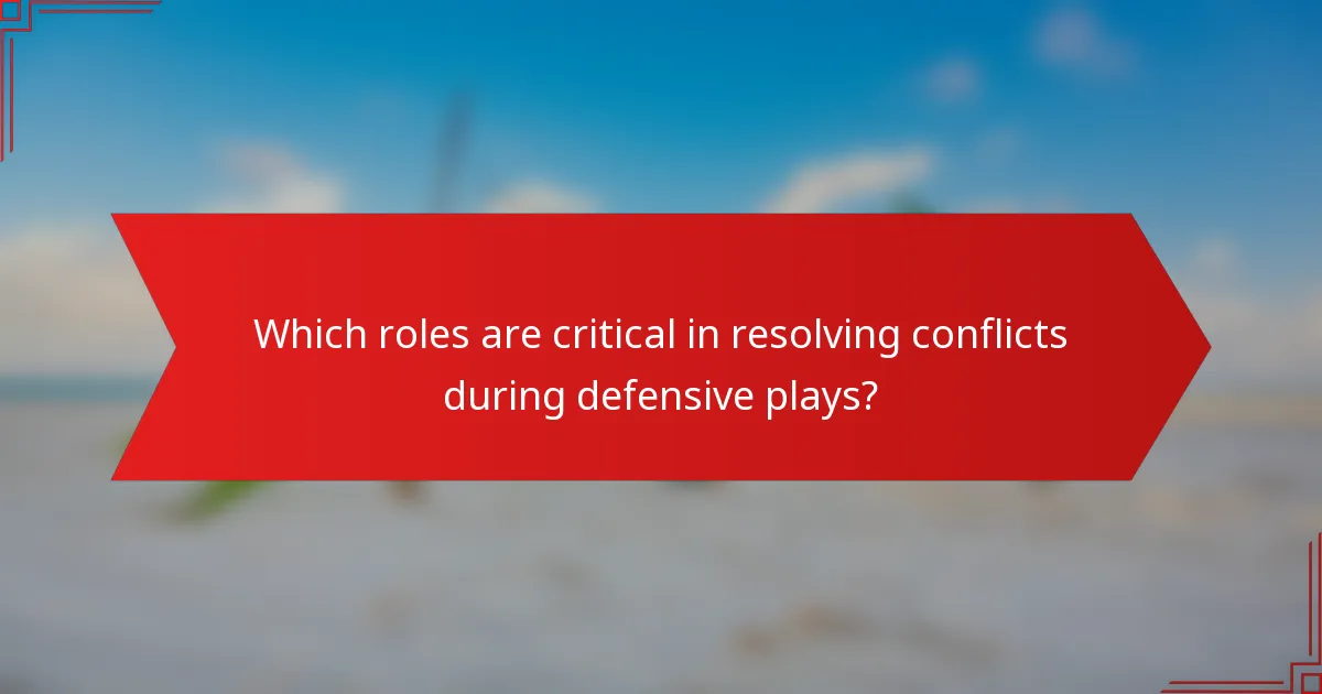 Which roles are critical in resolving conflicts during defensive plays?